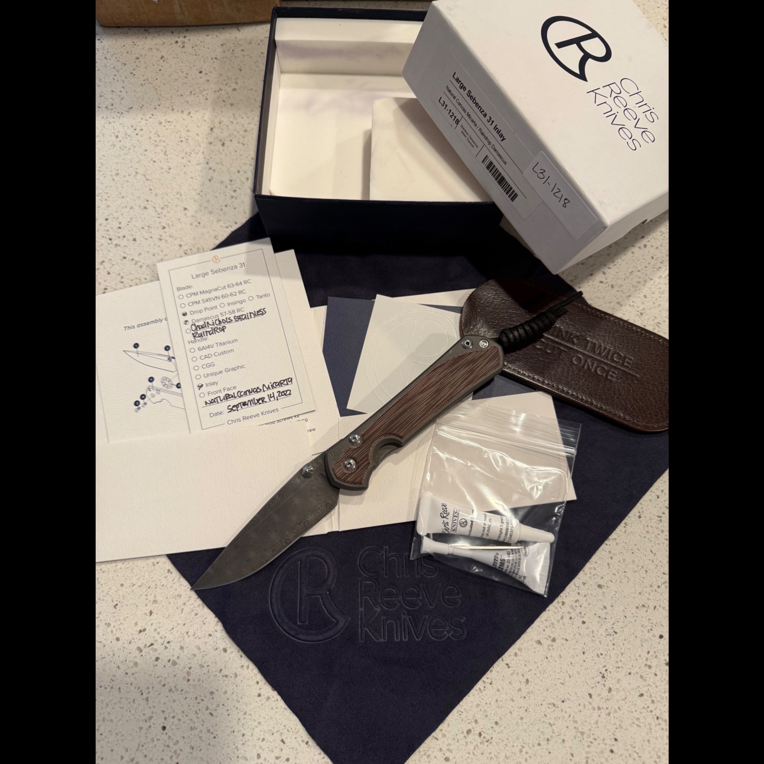 Bladebinge - *PRICE TO SELL* Large Sebenza 31 Raindrop Damascus