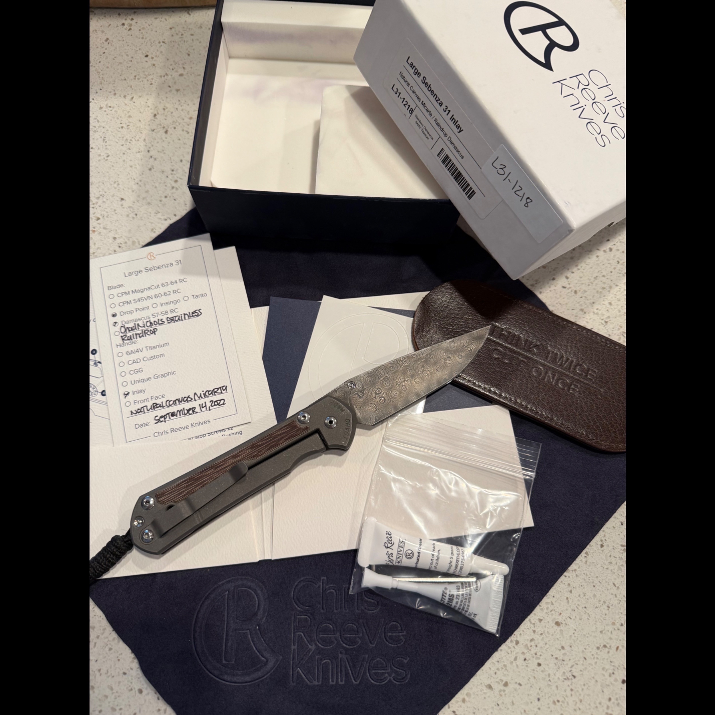 Bladebinge - *PRICE TO SELL* Large Sebenza 31 Raindrop Damascus