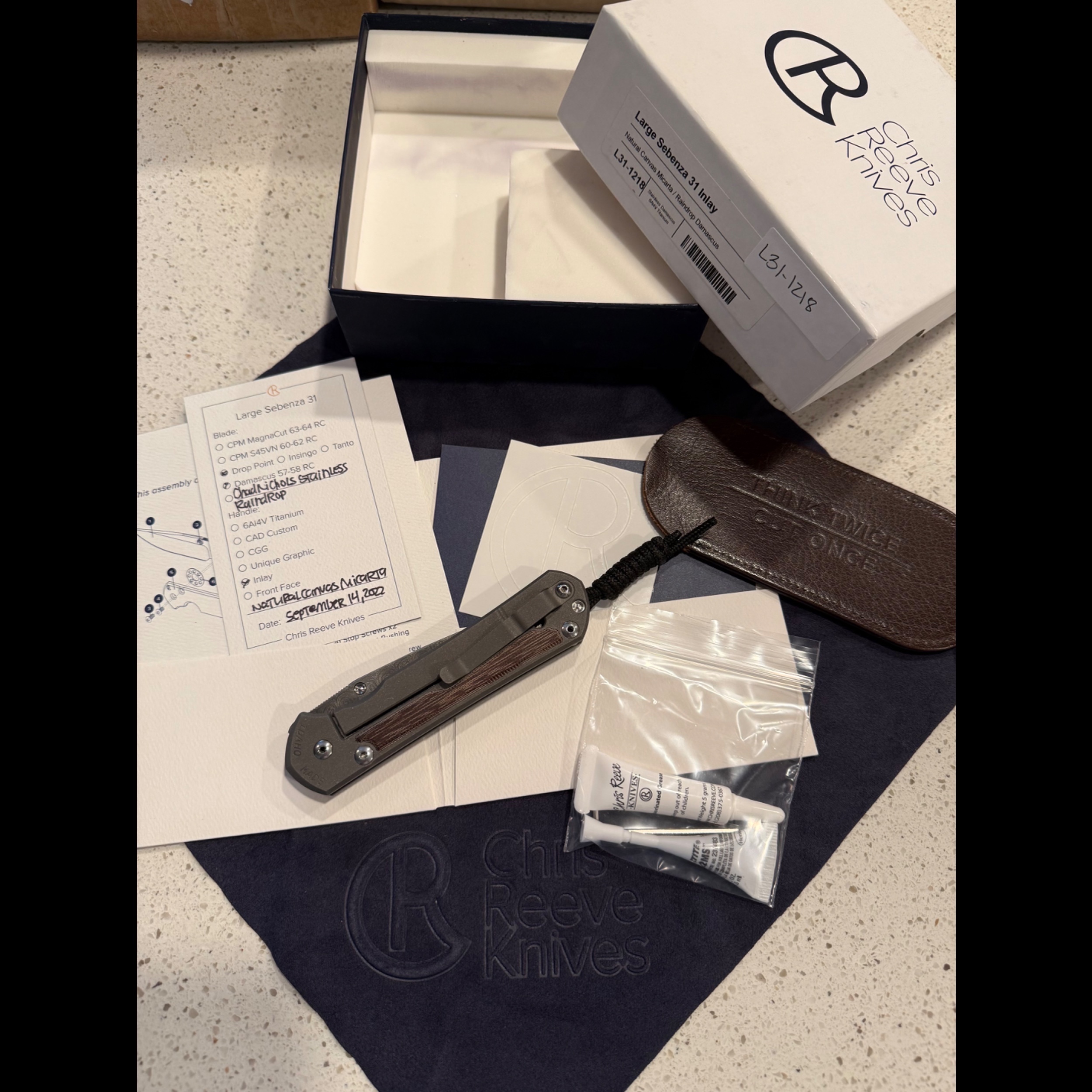 Bladebinge - *PRICE TO SELL* Large Sebenza 31 Raindrop Damascus